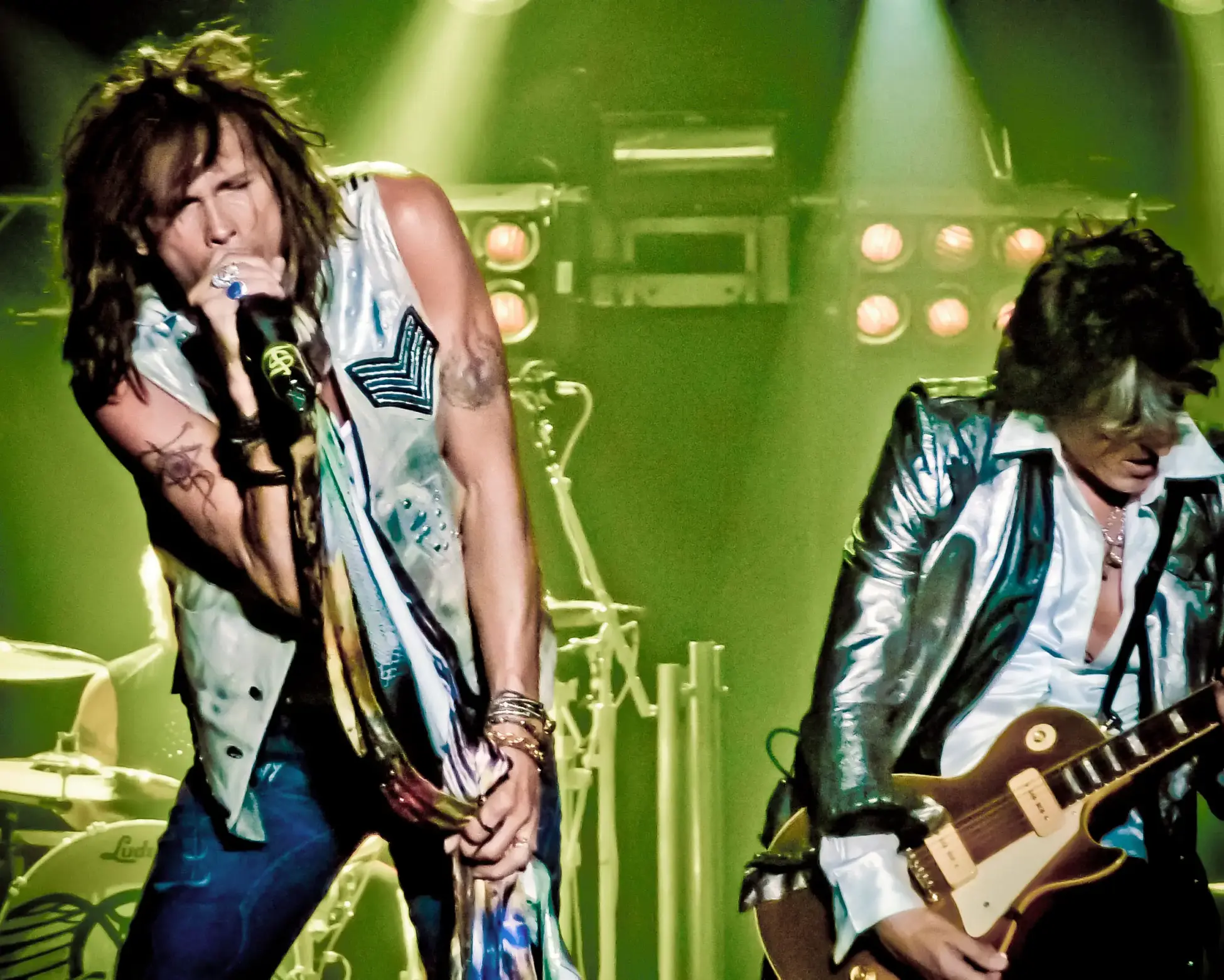 Steven Tyler sings beside guitarist Joe Perry during an Aerosmith concert in Arnhem, Netherlands, in 2010.