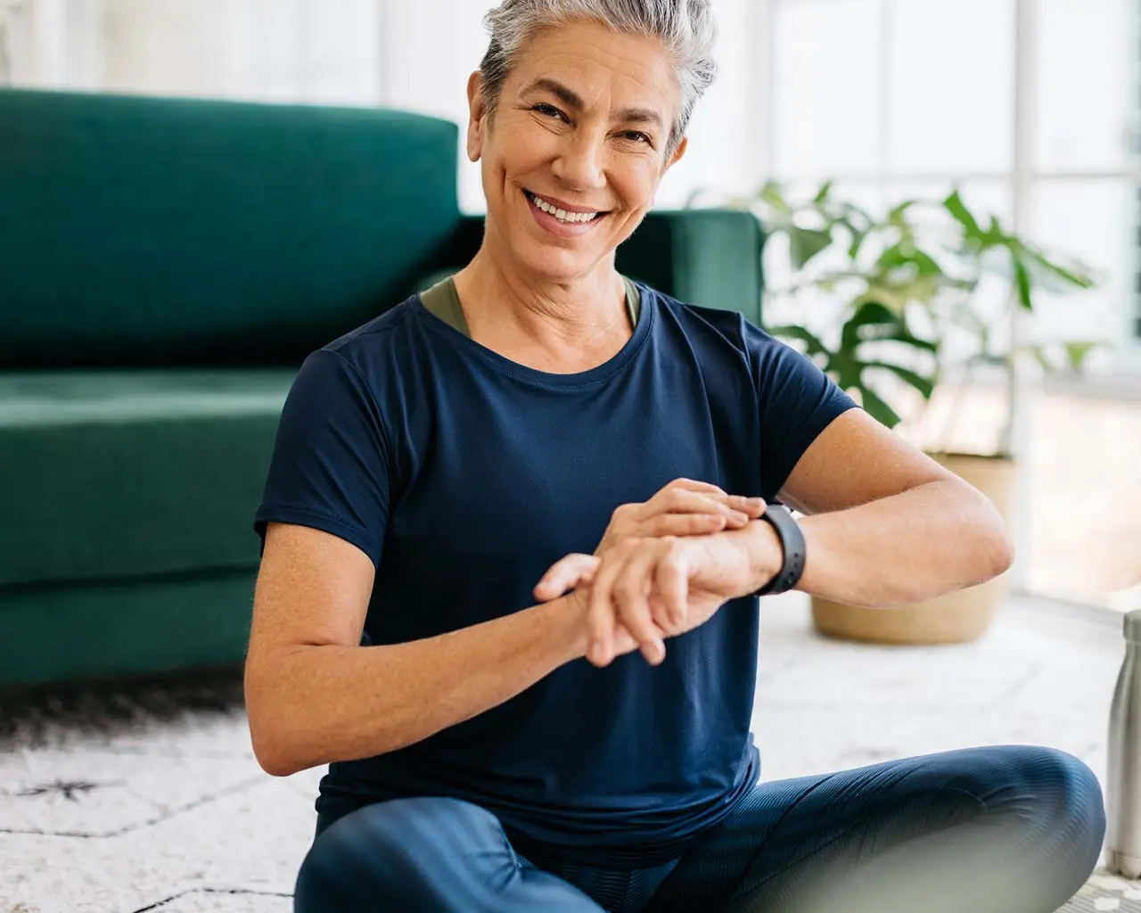 woman doing yoga with apple watch