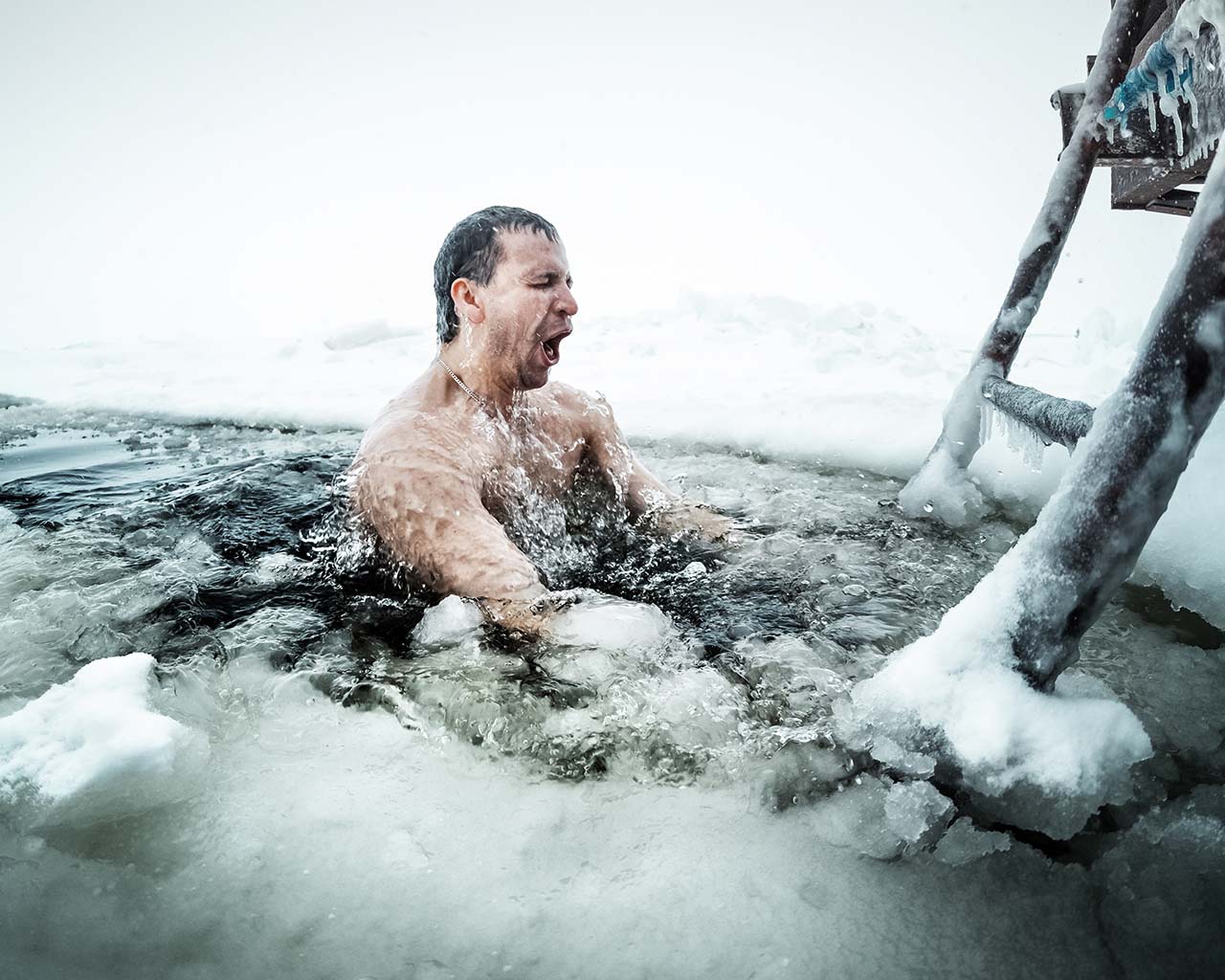 cold-plunge man doing a cold plunge