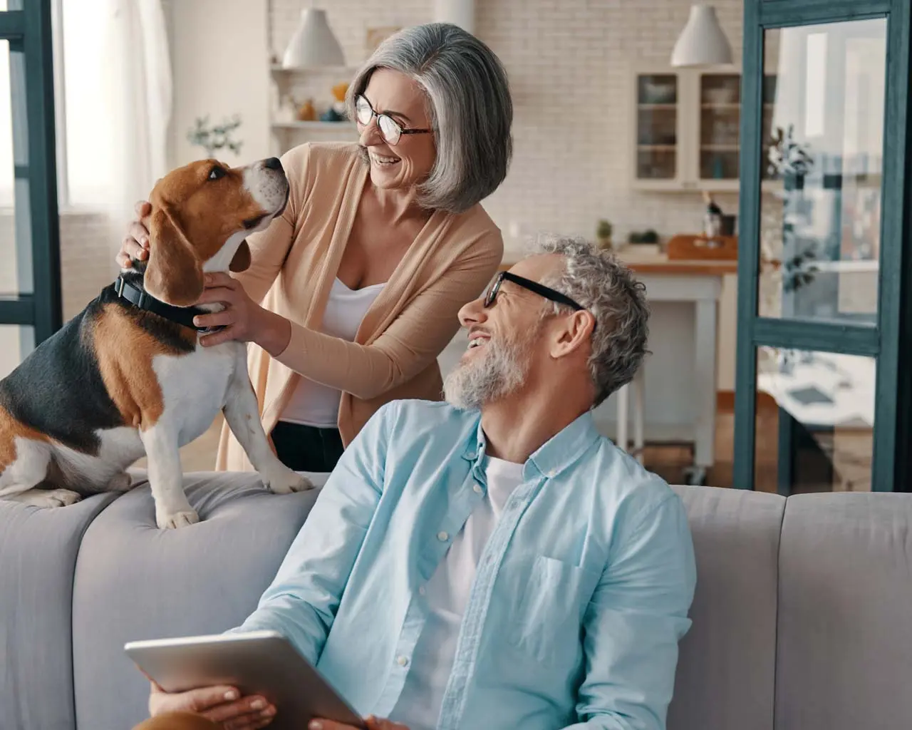 middle aged woman and man with dog